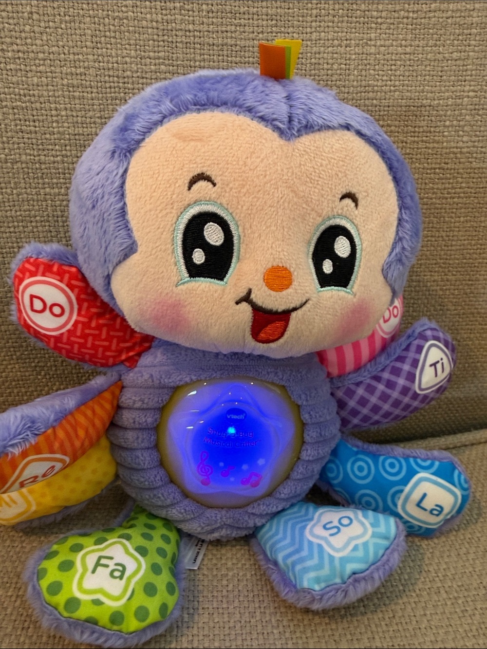 V Tech Snug a Bug Violet Musical Octopus Plush Toy with Light-Up Sound Panel